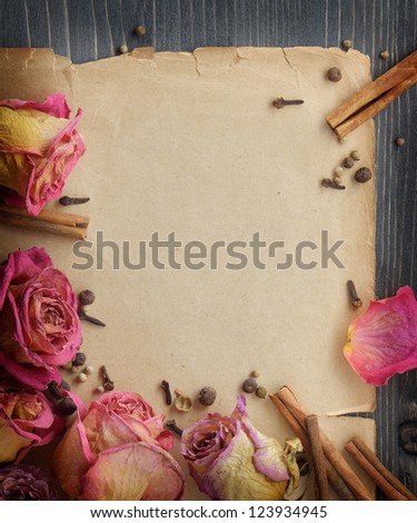 Decorative background with a note from old paper and flowers