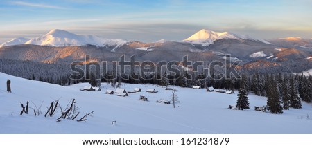Winter panorama of mountains in the early morning. Mining strong shepherds. Carpathians, Ukraine, Europe