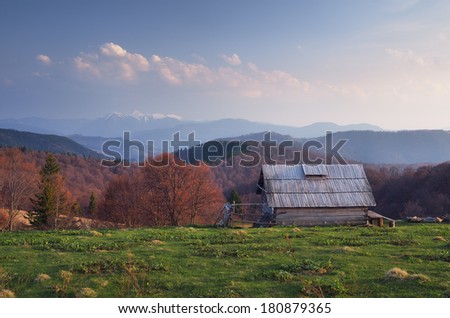 Spring landscape with a wooden house in the mountains. Carpathians, Ukraine, Europe