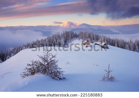 Beautiful Christmas landscape. Dawn in the mountains. The village of shepherds. Fresh snow. Carpathians, Ukraine, Europe