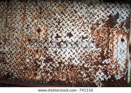 Rusty metal Panel Painted White Producing an interesting Texture