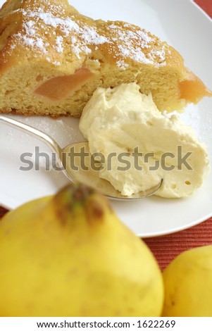 Cinnamon star anise poached, quince batter cake, with lemon vanilla cream. Quince fruit in foreground.