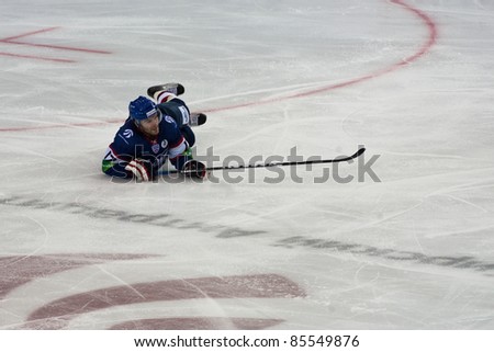 NOVOSIBIRSK - SEPTEMBER 26:  Ice hockey, the game between Siberia and AK Bars. Artem Kryukov forward is on the ice after falling, on September 26, 2011, Novosibirsk Russia