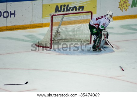 NOVOSIBIRSK, RUSSIA - SEPTEMBER 26: Goalkeeper Stanislav Galimov (AK Bars) stands ready to defend the goal post during a ice hocky game between Siberia and AK Bars on September 26, 2011 in Novosibirsk, Russia