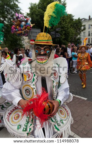 ROTTERDAM - JULY 28: Masked man in a summer carnival parade on the 28th of July, 2012 in Rotterdam. The summer carnival is yearly event that attracts around 800.000 visitors.