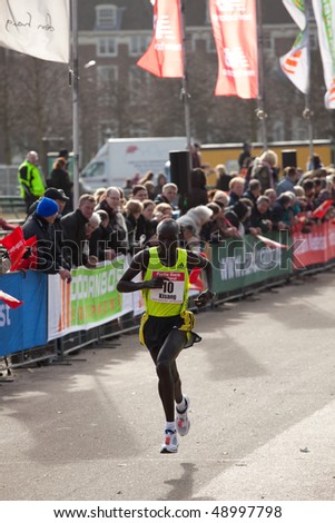 THE HAGUE - MARCH 14: Philemon Kisang approaches the finish of the the City Pier City Loop 2010, half marathon March 14, 2010 in the Hague, The Netherlands