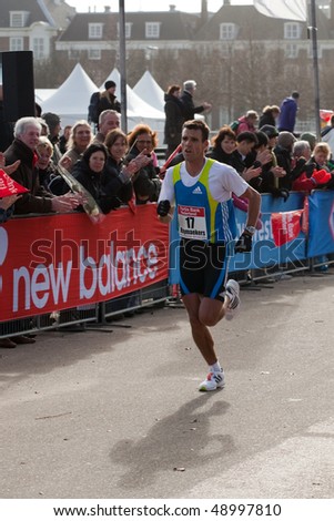 THE HAGUE - MARCH 14: Koen Raymaekers approaches the finish of the the City Pier City Loop 2010, half marathon March 14, 2010 in the Hague, The Netherlands