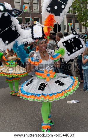 NETHERLANDS - JULY 31: Unidentified woman in the Summer Carnival parade on July 31, 2010 in Rotterdam, The Netherlands. This parade is organized every year and attracts 800.000 visitors.