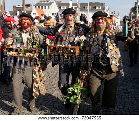 MAASTRICHT, THE NETHERLANDS - MARCH 6: Unidentified men in the Carnival parade dressed as French farmers on March 6, 2011 in Maastricht, The Netherlands. This parade is organized yearly with about 100,000 visitors.