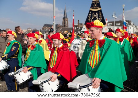 MAASTRICHT, THE NETHERLANDS - MARCH 6: Unidentified men of a brass band in the Carnival parade on March 6, 2011 in Maastricht, The Netherlands. This parade is organized every year with about 100,000 visitors.