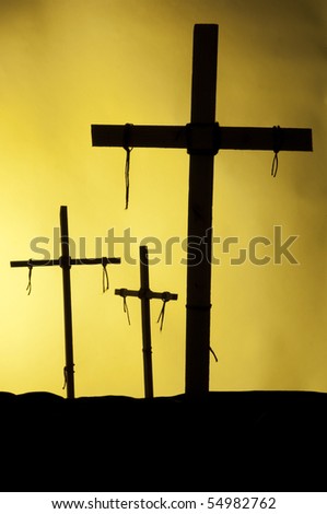Crosses against the light on a hill