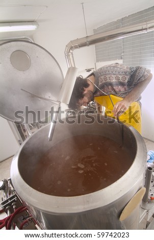 Brewer makes beer in his brewery