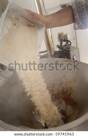 Brewer makes beer in his brewery