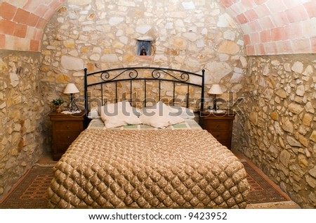 A rustic bedroom in a rural hotel