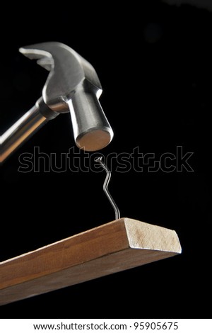 Hammering a crooked nail