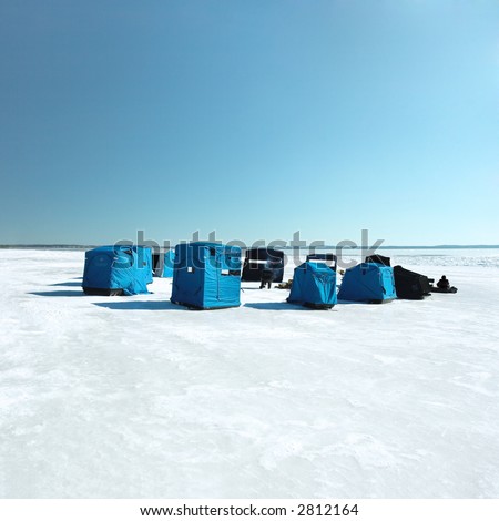 Ice fishing camp on a large lake