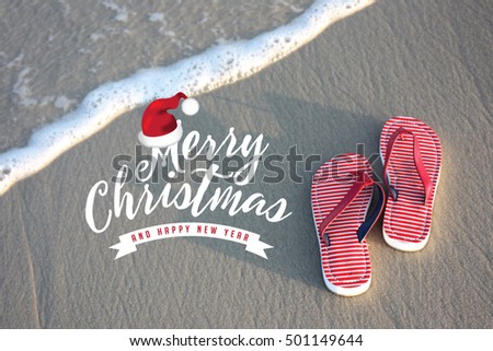 Merry Christmas from a tropical climate. Flip flops on the beach. For Christmas in June, July, August, December. Christmas card with copy space.