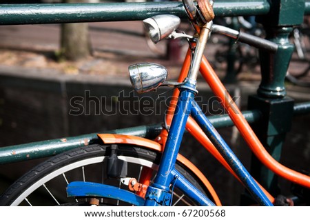 Pair of bicycles rested against each other in Amsterdam, the Netherlands