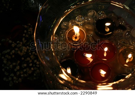 candles with flowers and glass jar