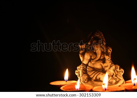lord ganesha with beautiful diya at diwali