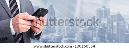 Businessman calling by phone. Technology background.