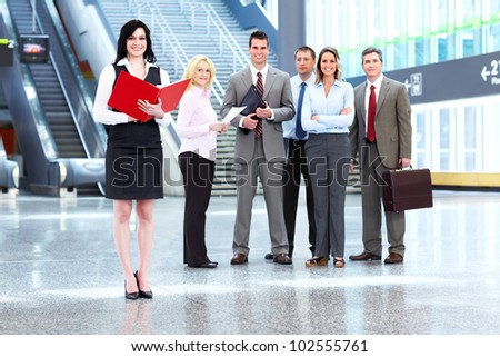 Executive business woman and a group of business person at the hall.