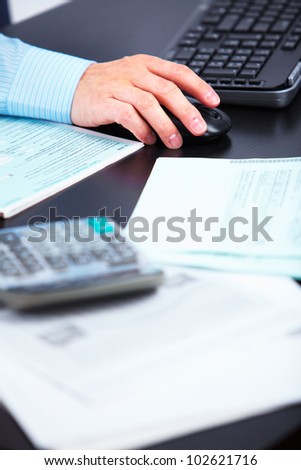 Hand of businessman accountant working with documents.