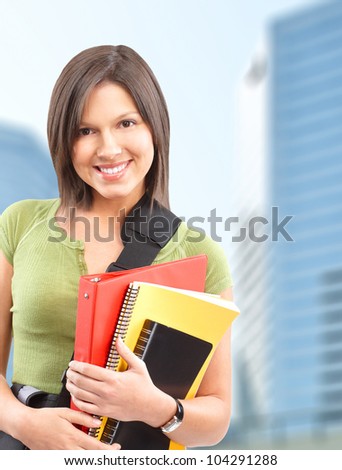 Young smiling  student woman with book. University education.