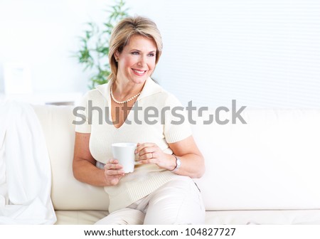 Happy senior healthy woman relaxing at home.