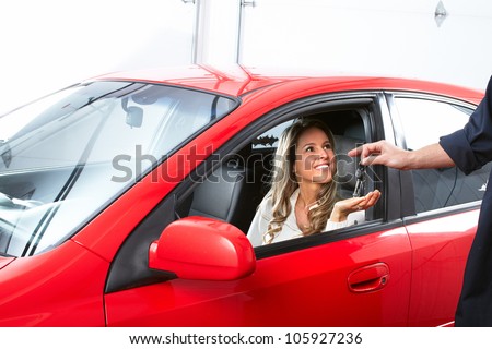 Auto mechanic and a client woman. Car repair service.