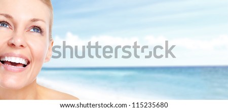 Happy woman relaxing on the beach. Resort.