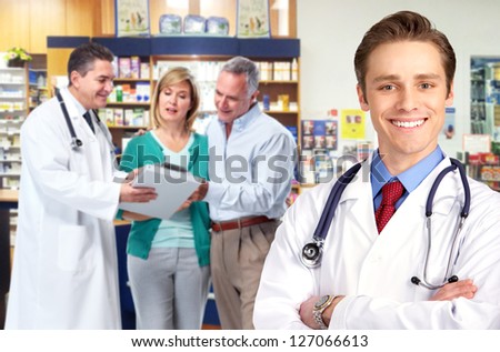 Pharmacist and a senior couple in pharmacy.