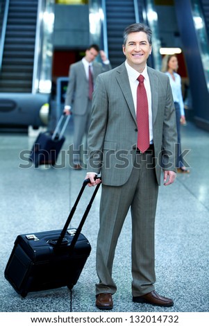 Group of business people in airport. Travel background.