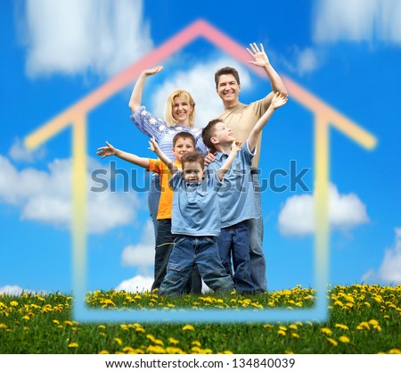 Happy family at home. Real estate and construction concept.
