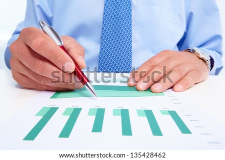 Hand of businessman with a pen. Finance and accounting business background.