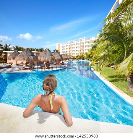 Woman In Swimming Pool At Caribbean Resort. Vacation.