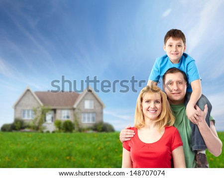 Happy family near new house. Real estate.