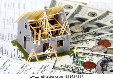 Family house with money. Construction background.