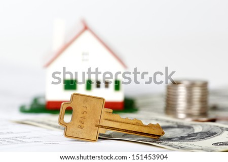 Family house with money and key. Real estate background.