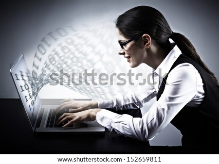 Woman working with laptop. Technology background.