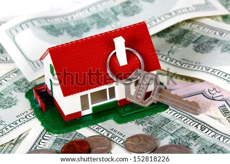 Family house with money and key. Real estate background.