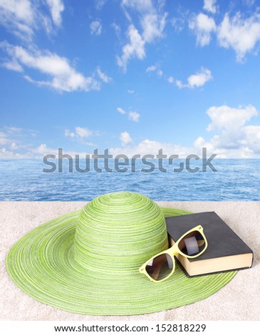Hat and book. Summer vacation beautiful background.