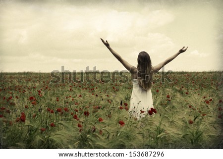 Happy beautiful woman in meadow. Freedom concept background.