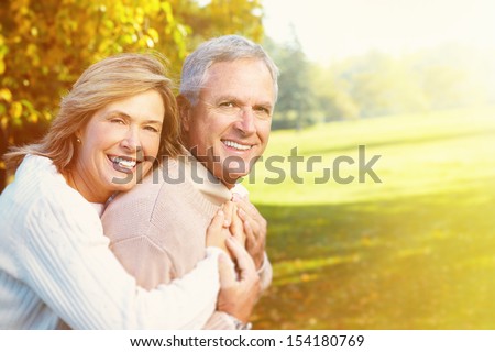 Happy Senior Couple Having Fun Together In Park.