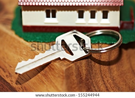 Family house with key. Real estate background.