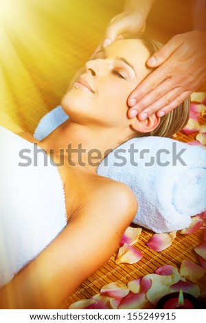Beautiful woman having anti wrinkle face massage.