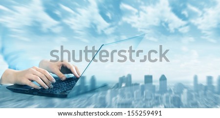 Hands of business woman with laptop computer keyboard.