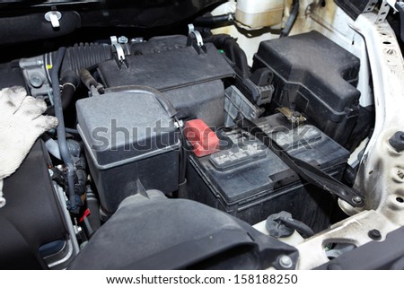 Broken car engine  in auto repair service.