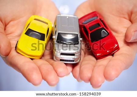 Hand with car. Auto dealership and rental concept background.