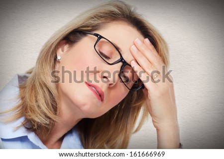 Elderly Woman having a headache. Stress and depression.